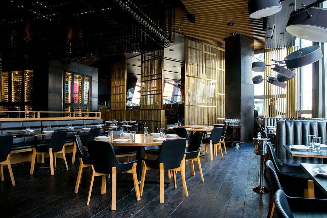 Restaurant dining area with staff and customers